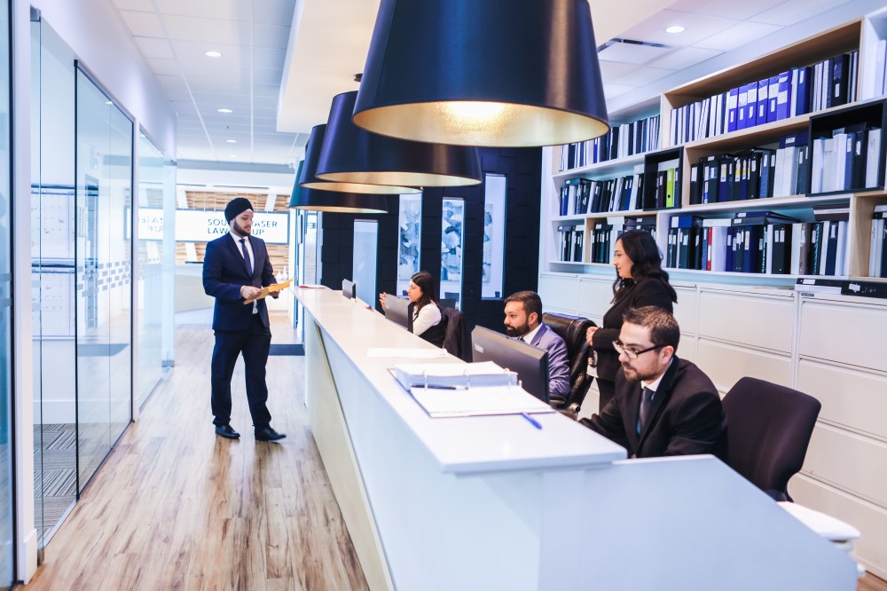 Lawyers working with clients in the office