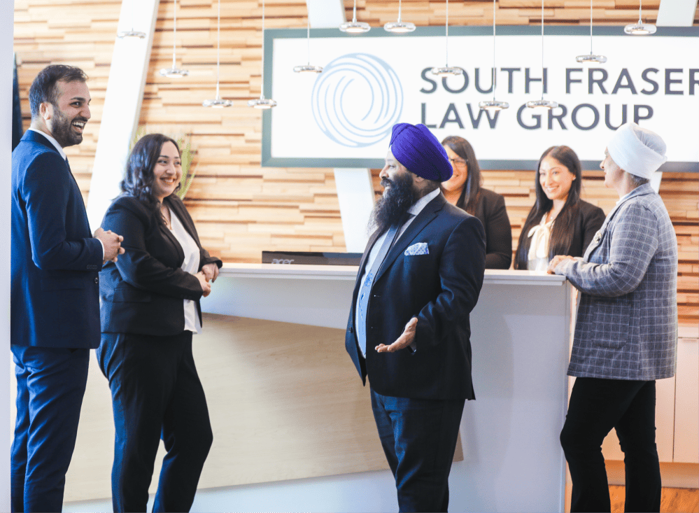 Lawyers talking in the firm’s reception area